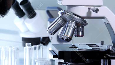 African-american scientist working in lab. Doctor making microbiology research. Biotechnology, chemistry, bacteriology