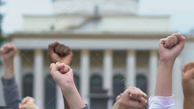 Activist waving raised arms supporting presidential candidate, election campaign