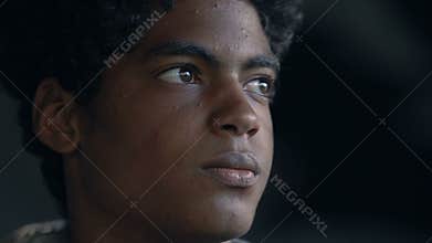 African-American guy looking up, dreaming about better future, social insecurity