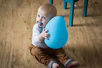 Baby boy with balloon