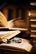 Glasses on open books