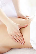 Close-up of a young woman receiving a back massage