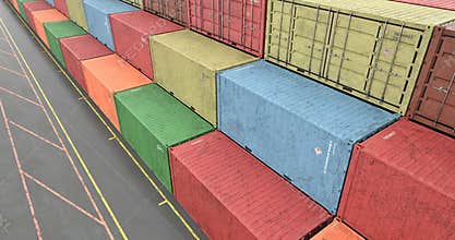 High angle view of stacked cargo shipping containers at transportation port