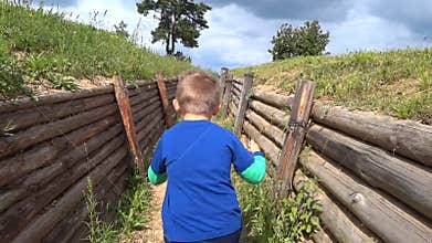 The child is lost in the trench, running from fear and looking for a way out