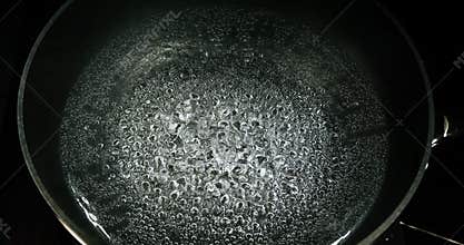 Hot boiling water in a saucepan, slow motion 4K