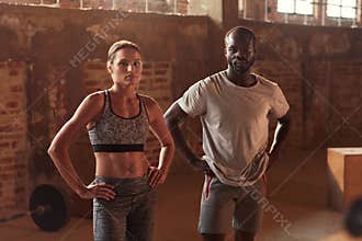 Sport people after exercising at gym portrait. Fitness couple