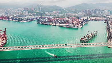 Hyperlapse time-lapse of Stonecutters bridge and Hong Kong port with cargo container ship, crane, and car traffic