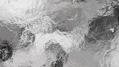 Shiny wrinkled silver foil texture. Crumpled metal background.