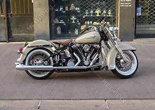 Old classic Harley Davidson motorcycle parked on a sidewalk in Juan Les Pins near Antibes, France