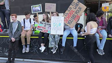 London / UK - September 20th 2019 - A group of young activists hold climate change protest signs at the Climate Strike