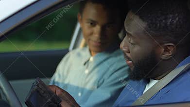 African-american teen boy arguing with dad, taking money and leaving awkward age