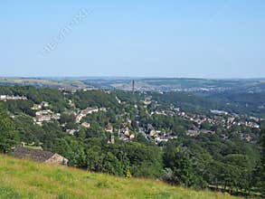 View of the town of halifax from high west yorkshire countryside surrounded by trees fields and nearby villages
