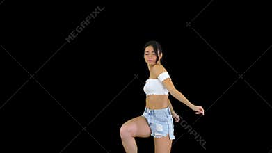 Adorable hispanic female model in denim shorts dancing, Alpha Channel