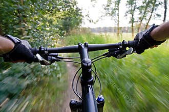 Riding mountain bike, motion blur