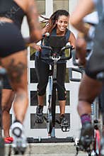 Female Instructor Leads Spin Class At Pretty Girls Sweat Festival