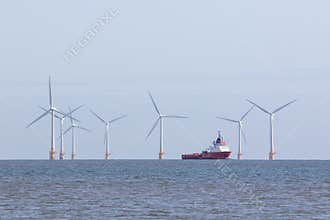 Offshore wind farm turbines with maintenance supply vessel ship