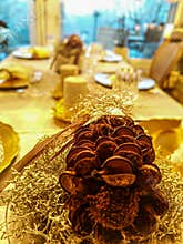 Festive Christmas table with pinecone decoration