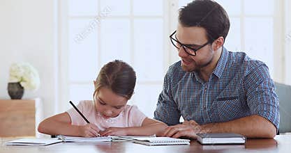 Dad and child daughter studying together giving high five