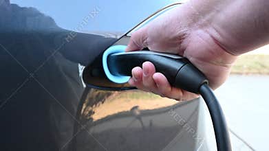 Unplugging a charge cable from an electric car