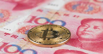 4k resoltuion of a gold Bitcoin coin with China currency Renminbi, Yuan - pan movement