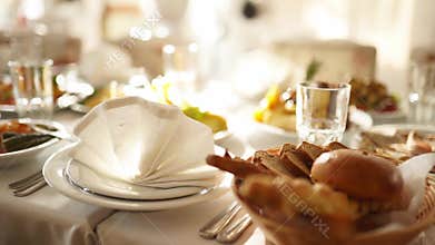 Beautifully served banquet table with different food snacks and appetizers in the sun on corporate christmas birthday