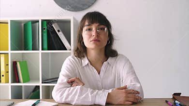 Young girl at an interview at a table