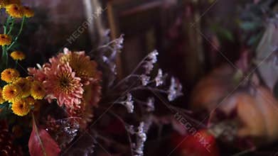 Beautiful autumn still life decoration details with flowers and pumpkins, fall harvest arrangement