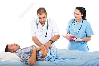 Doctor palpating patient abdomen