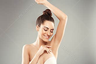 Armpit epilation, lacer hair removal. Young woman holding her arms up and showing clean underarms, depilation  smooth clear skin .
