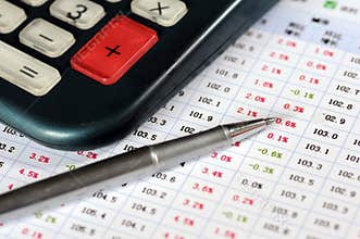 Calculator, ball-point pen, and data analysis chart
