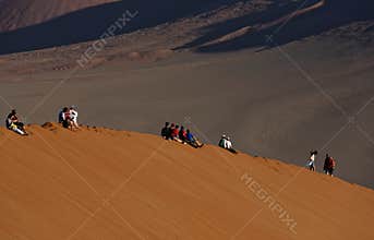 People on sand dune, Namibia