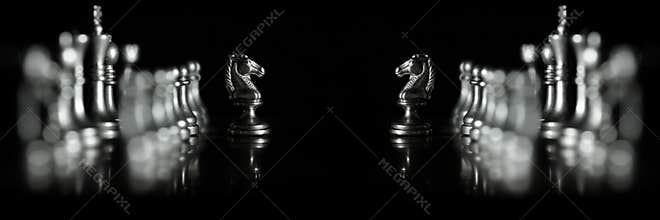 Pieces on chess board for playing game and strategy competition face off