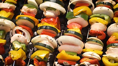 Multiple colorful and tasty grilled shashliks on outdoor summer barbecue