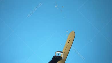 Wrist watch fell into the water. blue background. closeup