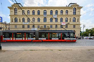 A tram passes the Academy of Arts, Architecture and Design Building in Prague