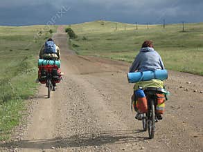 Couple of cyclists have a bicycle travel.