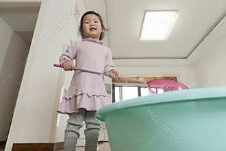 Little daughter playing fishing game at home, indoor life