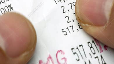 Closeup hands scrolling and checking receipt or bill