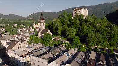 Aerial Drone shot of Brunico or Bruneck, a small town in South Tyrol. Evening time in Italian Alps Alto Adige