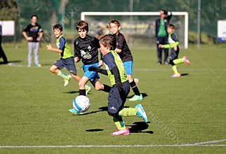 Young children playing Football or Soccer