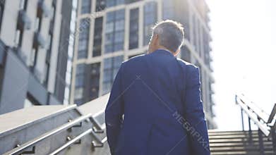 Businessman Wearing Office Formal Suit, Walking Outdoors in Urban City. Businessman Goes Up to Success - Key to Success
