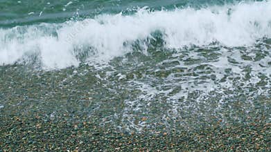 Nature Concept. Beach With Pebbles Stones. Blue Ocean Or Sea Wave Washes The Shore. Still.