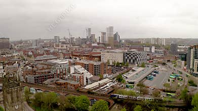 4K aerial footage of Granary Wharf and train station in Leeds, UK