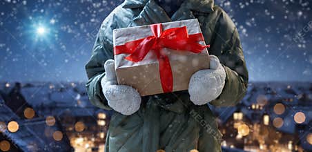 child with present against star sky