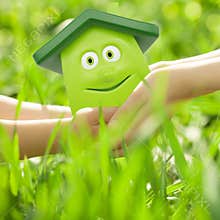 Eco cartoon house in hands