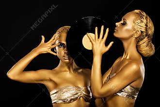 Fetish. Women DJs holding Retro Vinyl Record. Fantastic Gold Badyart. Performance