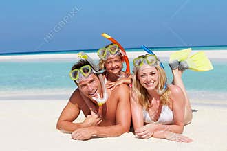 Family With Snorkels Enjoying Beach Holiday