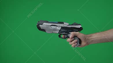 In a shot on a green background, a chromakey male hand that holds, holds out a plastic gun, a blaster, he pulls the