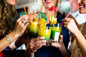 Young women with cocktails in club or Bar