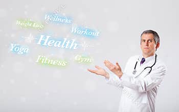 Clinical doctor pointing to health and fitness collection of words